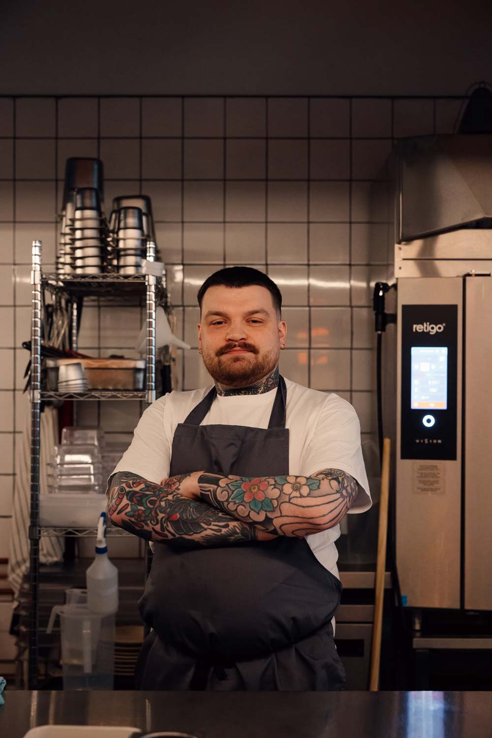 Trattoria Maria Head Chef Sam Armitage stood in kitchen