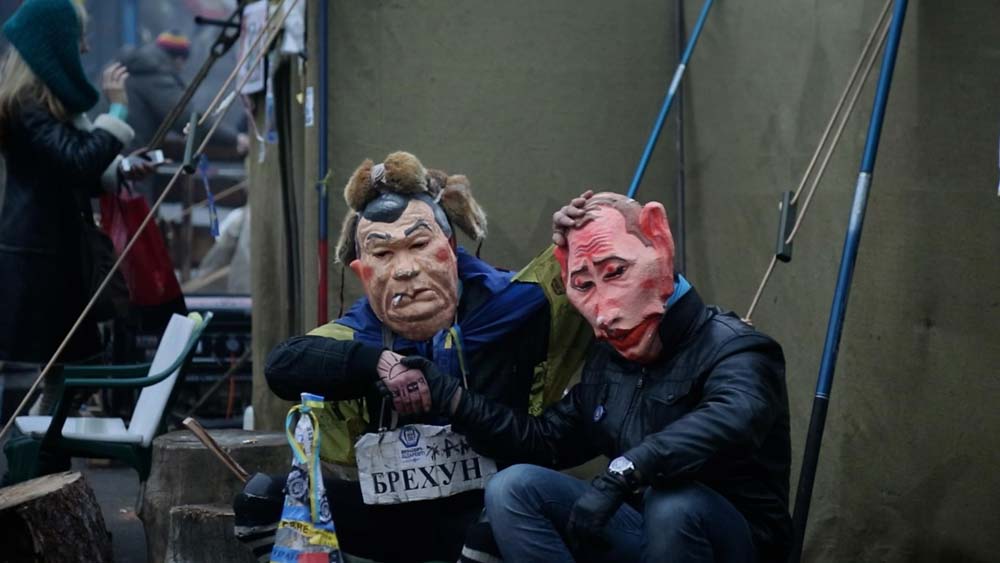 two people in masks sat down